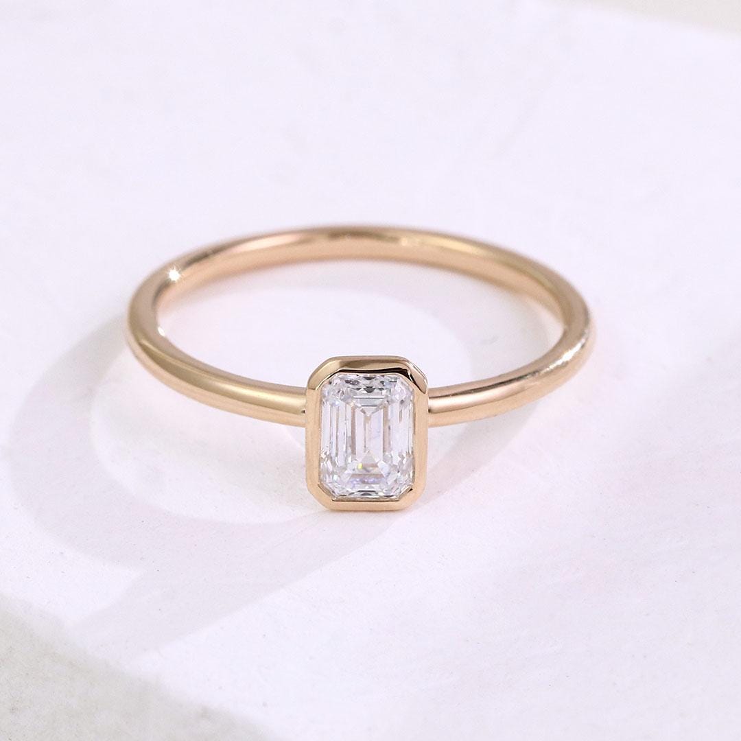1.50 Carat Emerald Cut Lab Grown Diamond Engagement Ring: 14k Yellow Gold Bezel Solitaire