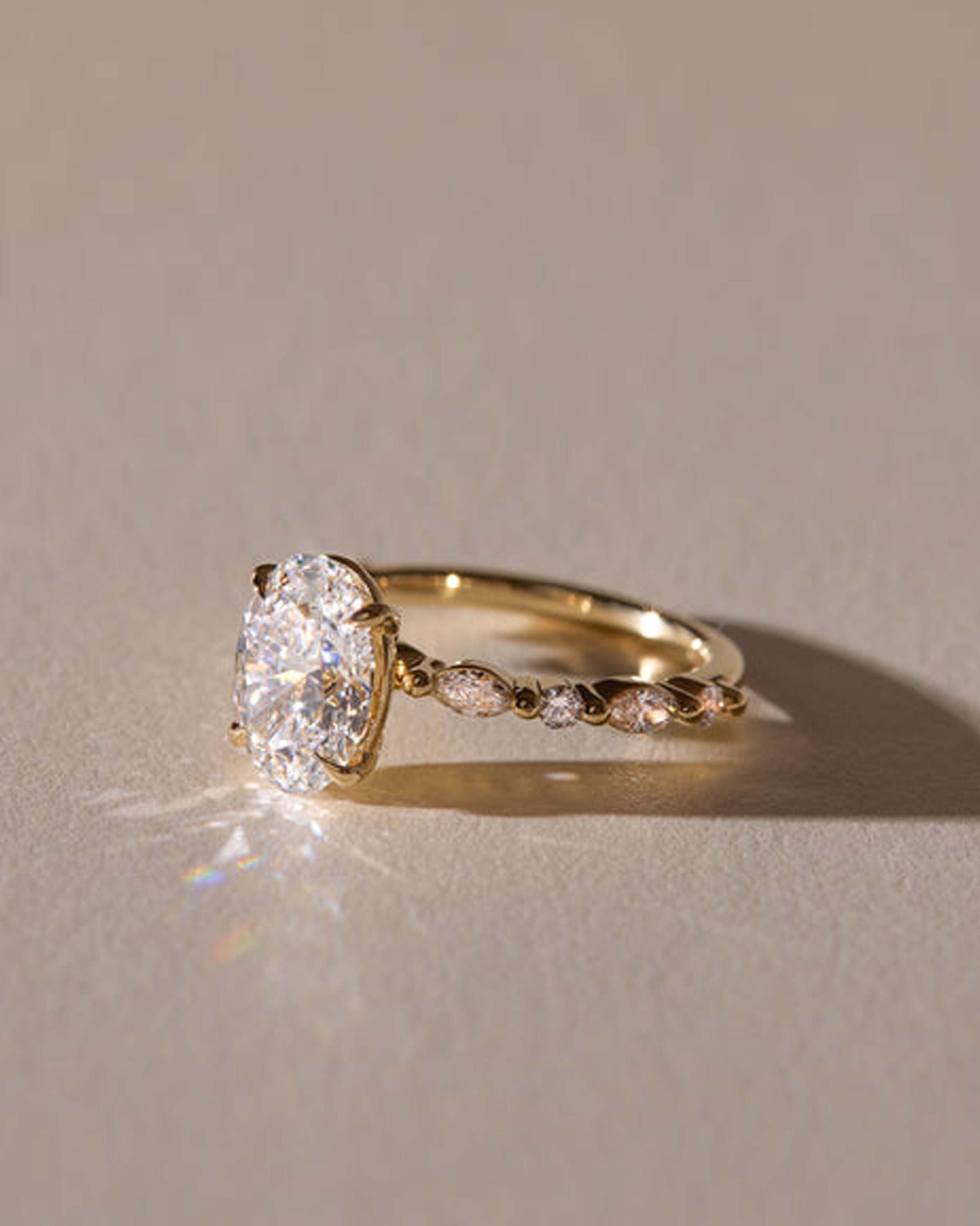 Oval Lab Grown Diamond Engagement Ring: Marquise & Round Side Stones