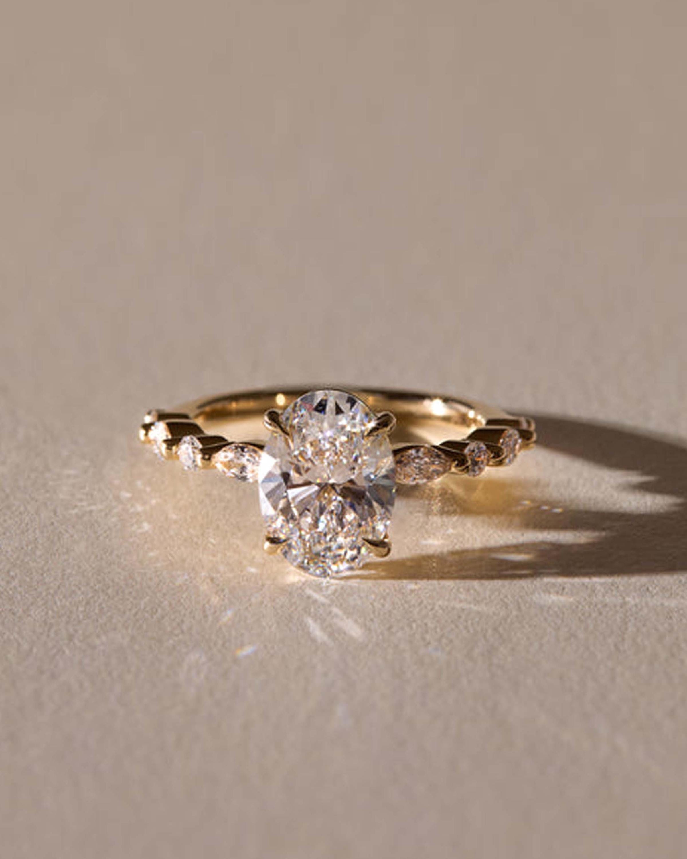 Oval Lab Grown Diamond Engagement Ring: Marquise & Round Side Stones