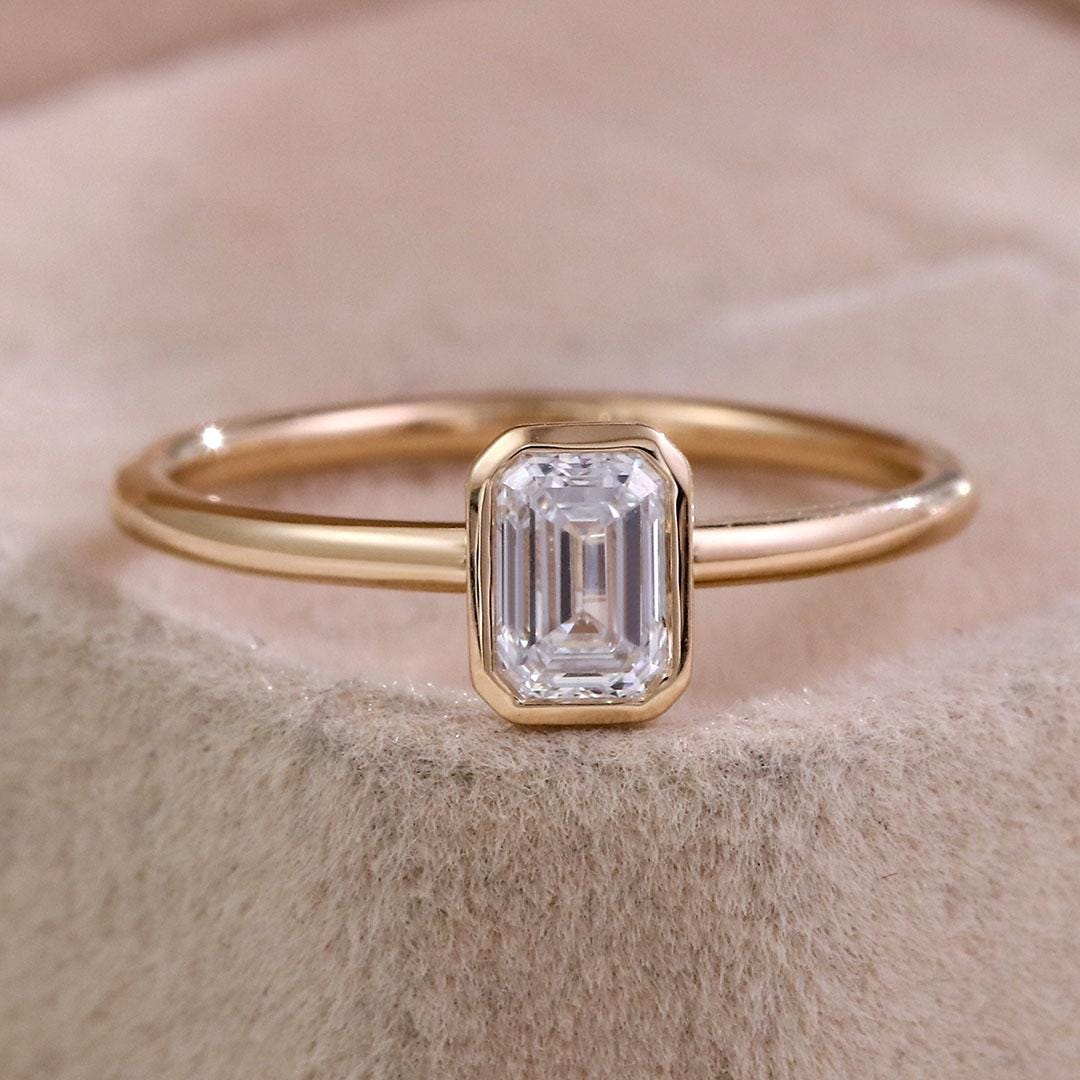 1.50 Carat Emerald Cut Lab Grown Diamond Engagement Ring: 14k Yellow Gold Bezel Solitaire