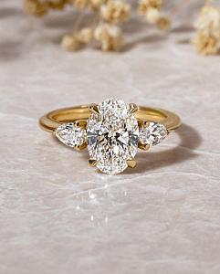 Lab Grown Oval Diamond Trilogy Ring: 14k Gold Pear Side Stones - Image 1