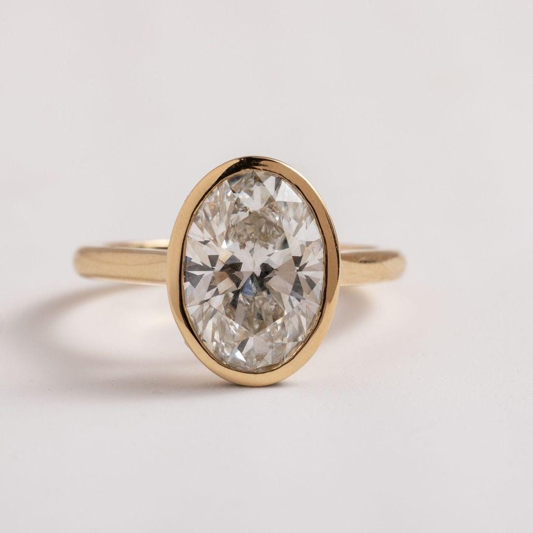 2Ct IGI Certified Oval Lab Grown Diamond Ring: 14K Gold Bezel Setting